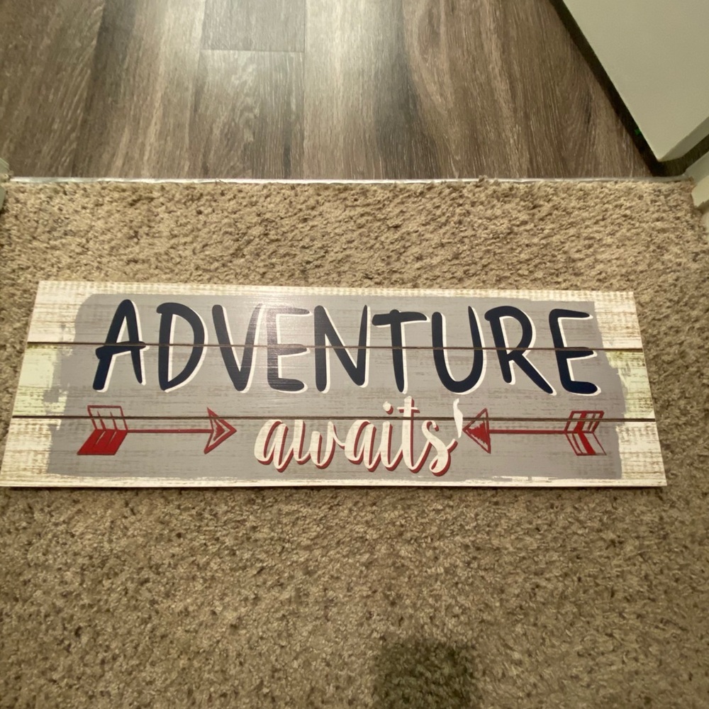 Adventure Awaits Sign